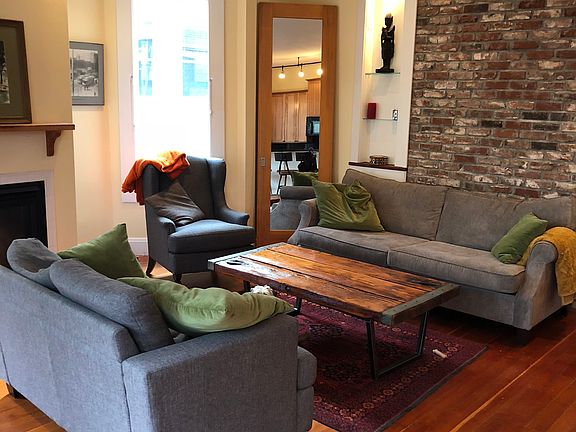 Living room with vaulted ceilings, gas fireplace, newly painted.