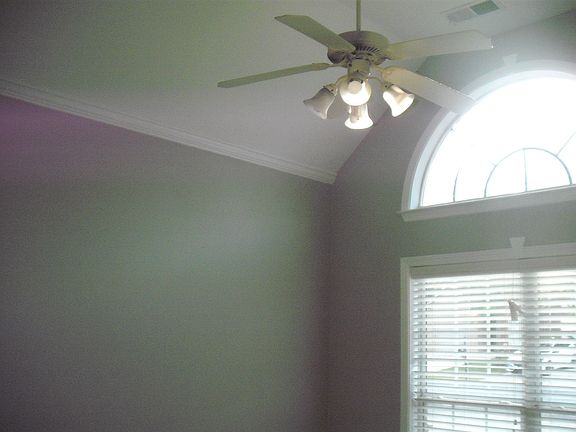 2nd bedroom with soaring ceilings.