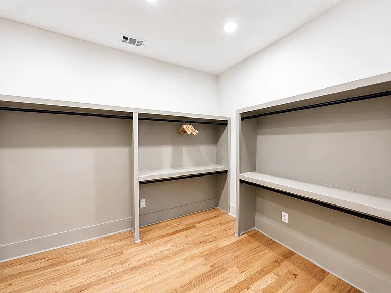 One of two large closets in the Edgewood Suite, stocked with everything you need for your stay including hangers, laundry baskets, extra bedding, pillows and towels.