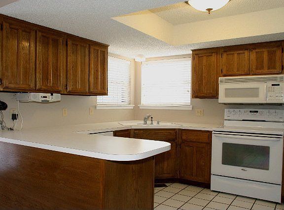 Neutral Kitchen with Newer Micro and Stove