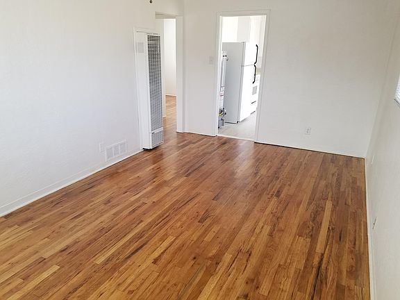 Living room with view to kitchen