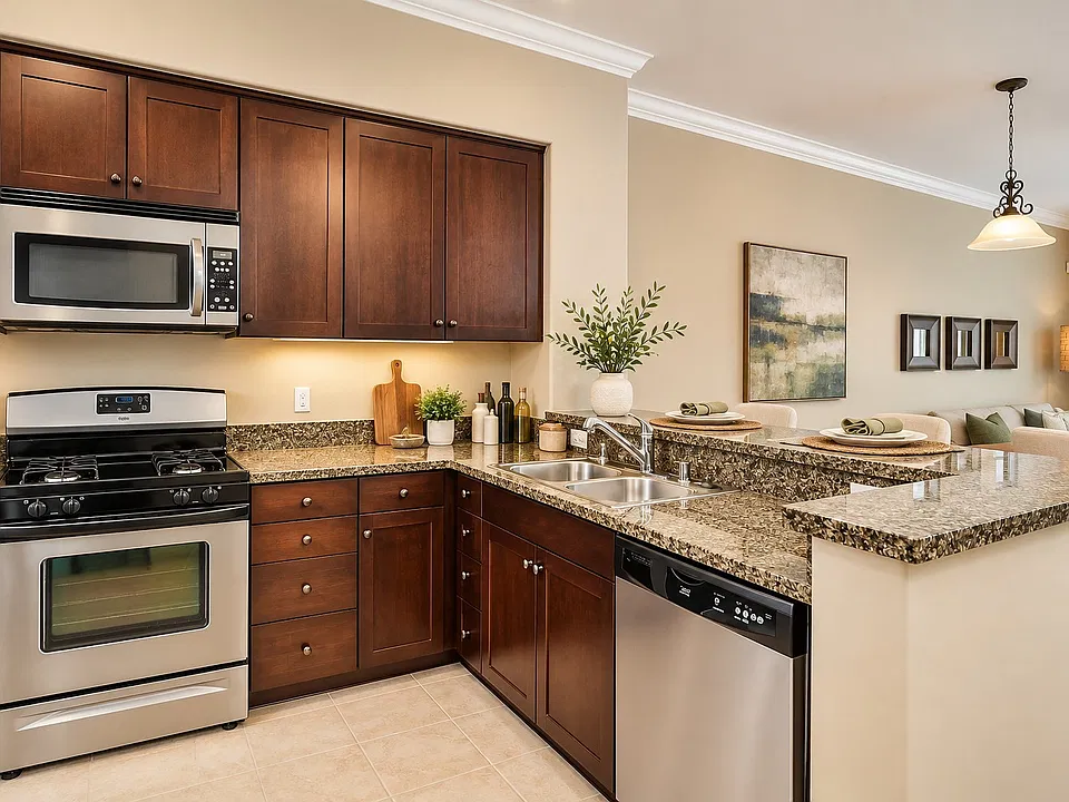Step into luxury at The Pointe with this beautifully designed kitchen featuring stainless steel appliances, sleek granite countertops, and modern cabinetry. Perfect for both cooking and entertaining. Schedule your tour today to see it in person!