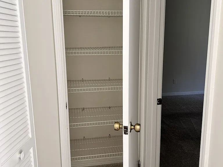 hall closet outside of main bedroom