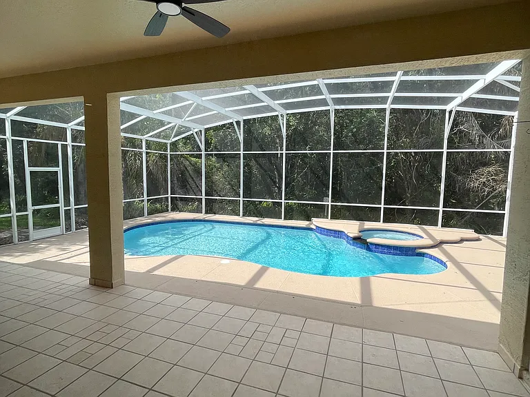 Covered patio and pool on conservation lot