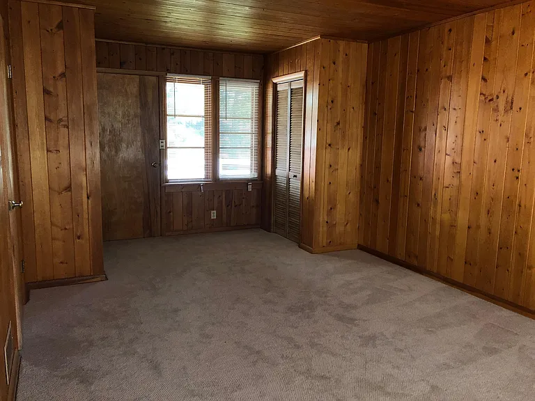 Back Bedroom with Closets and Door to Backyard