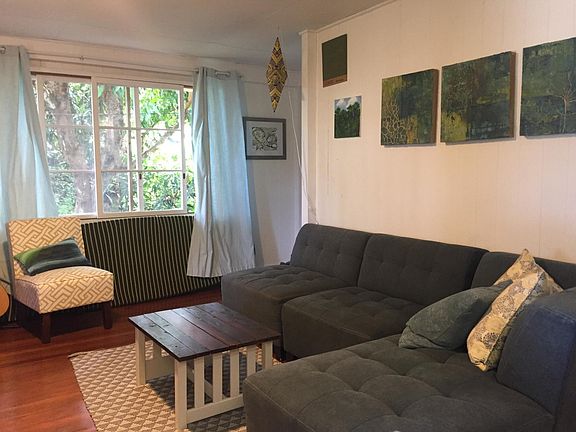 Living area with view of mango tree