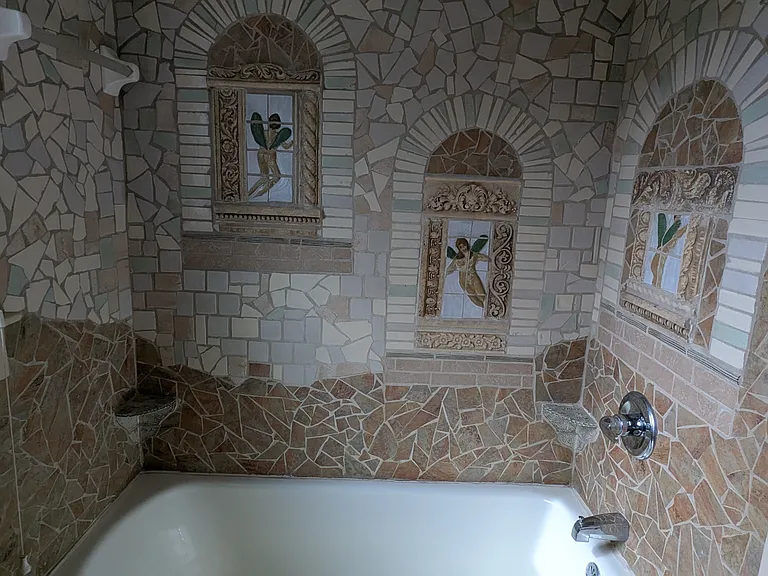 Bathroom 1 tub local artist Pam Brewer fairy tiles