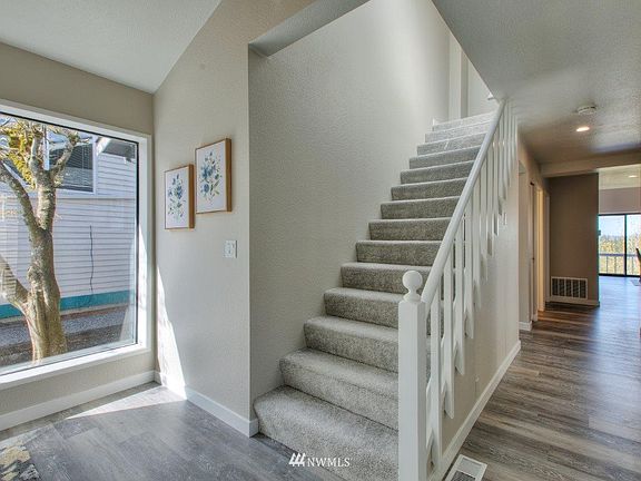 Front entrance; notice the tree outside the large entry window. 
