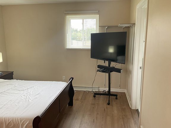 Roku TV on a cart with Spectrum TV app.