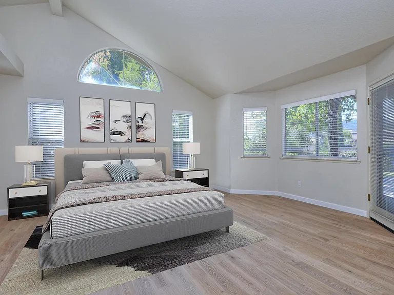 Spacious primary bedroom suite with easy access mandoor to backyard area