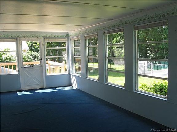 The enclosed porch opens to...