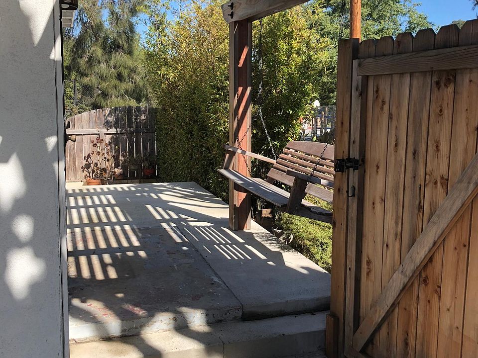 Gated entry with doorbell and lock.