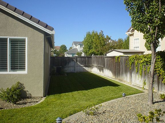 Large Backyard that extends around the side of the house