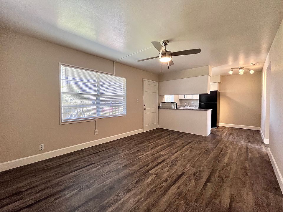 Experience modern living in this stylish apartment featuring an open-plan kitchen and living area.