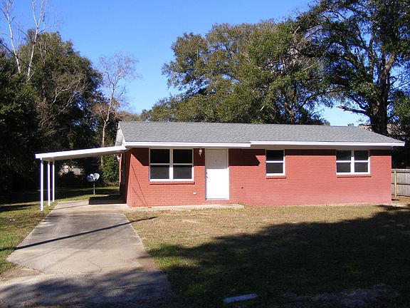 Brick ranch style home with carport. New Roof, New Windows!