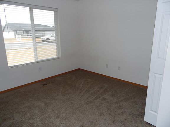 The bedroom in the front of the house is a nice size. The window lets in natural light. his room could also be used as an office, tv room, hobby space, or playroom.