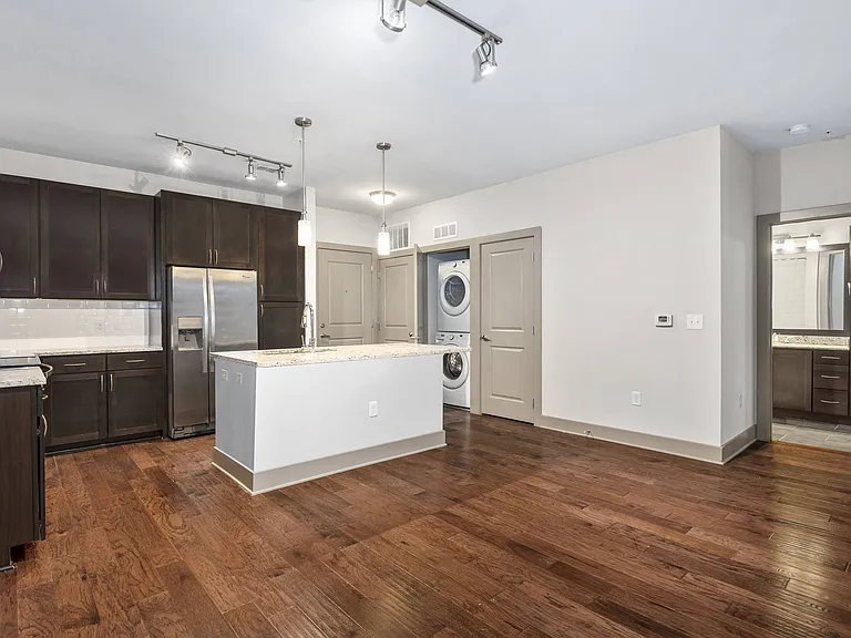 Gourmet Preparation Island with Pendant Lighting in Select Apartments
