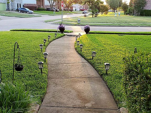 Sidewalk is wet sprinklers