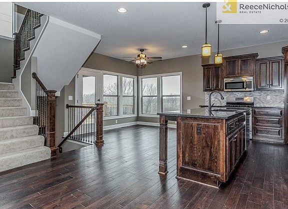 (Upgrade shown: Additional Breakfast Window, Mosaic Backsplash,Stainless Steel Finish on Appliances, Deck)