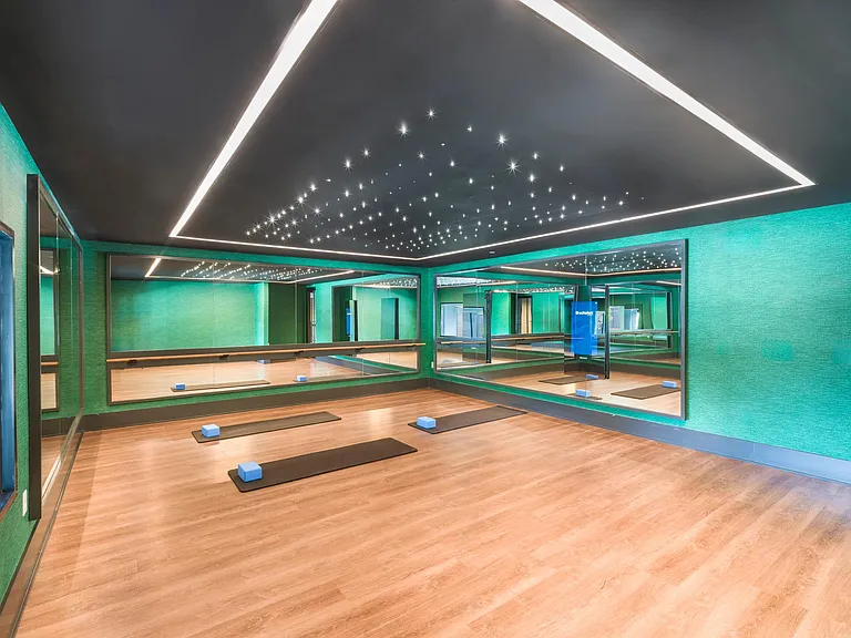 Find your flow in the dedicated yoga and wellness studio_complete with mirrored walls, soft lighting, and plenty of space to stretch and recharge.