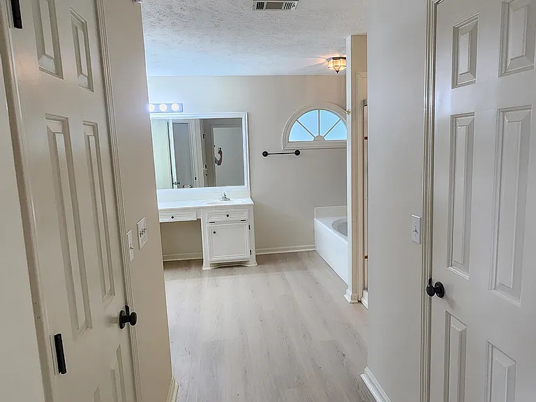 Hallway to Master Bedroom Bathroom, his and her walk-in closets