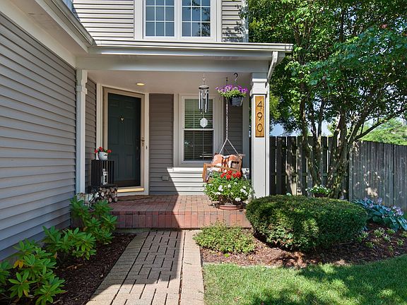 Paver walk way leads to your covered front porch.