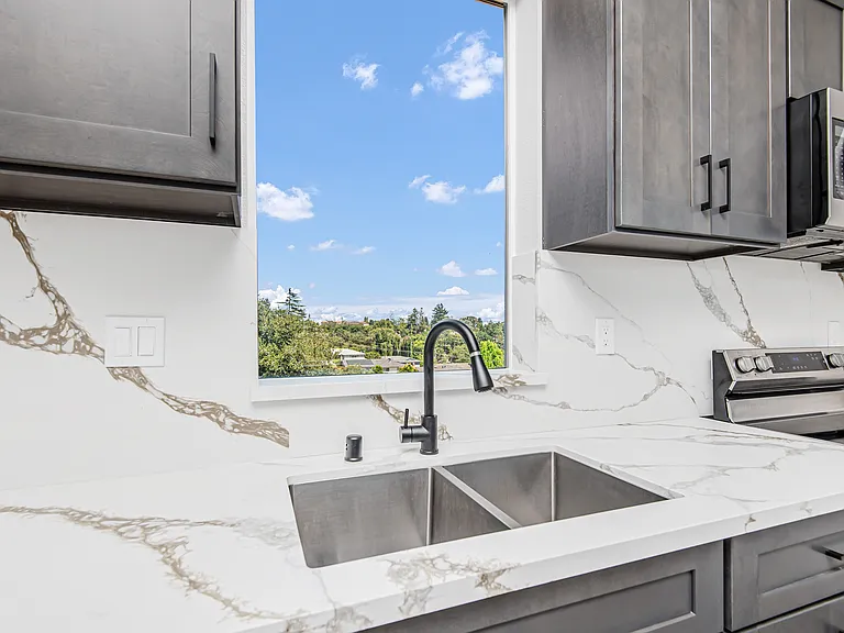 Deep double sink, soft close cabinetry