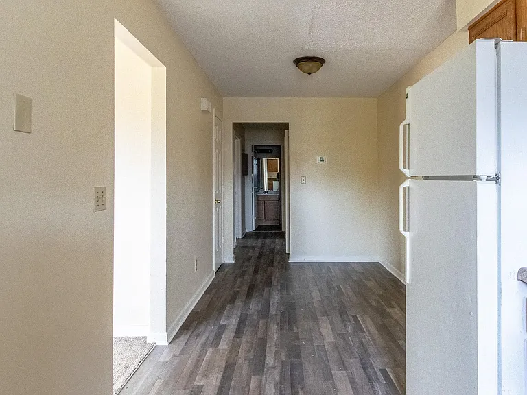 Dining Area Leads to Bedrooms and Living Room