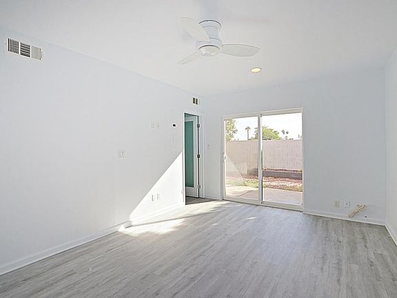 Downstairs bedroom, with entry to private back-yard