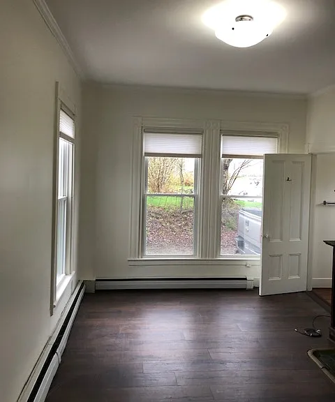 Entrance View into This Bright, Sunny Living Room With Beautiful Original Window Moldings, Fireplace Mantel