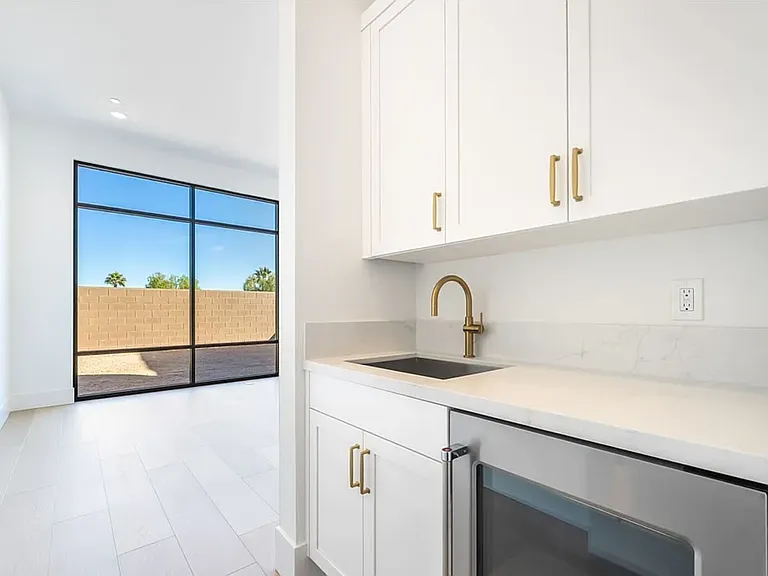 Wet bar in first floor bedroom