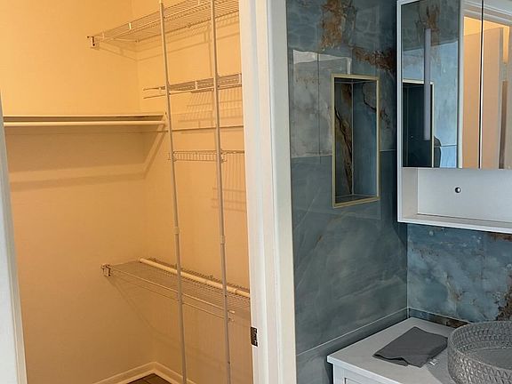 Primary bedroom's walk-in closet 7'3" x 5'8"