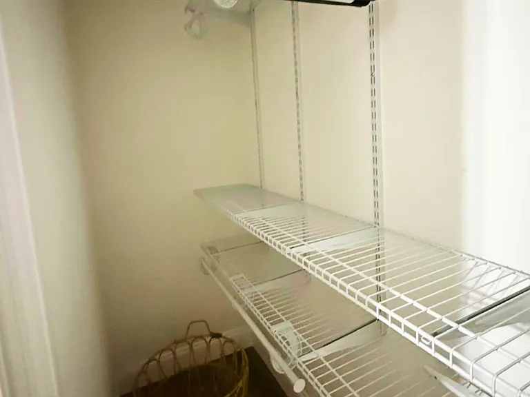 Spacious closet with ample storage for clothing and personal belongings.