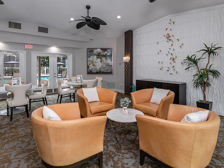 Enjoy a warm welcome in our modern leasing office, featuring elegant seating, contemporary decor, and views of the pool.