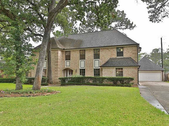 Extra wide driveway leads to two-car garage and back yard.