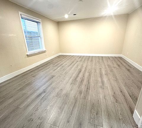 Large, well lit living room off kitchen