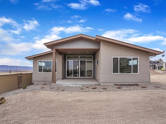 Rear with covered patio.