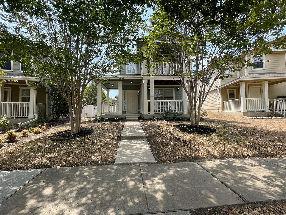 The front porch and balcony include chairs and a table!