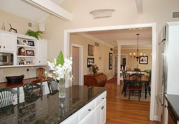 Kitchen View to Daily Dining Area and Family Room