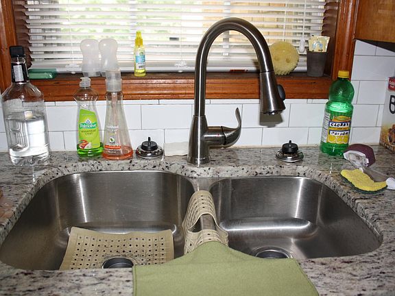 Kitchen has granite counters, new sink and faucet.