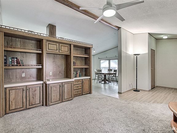 View from living room to entry and dining room, note the large windows!>