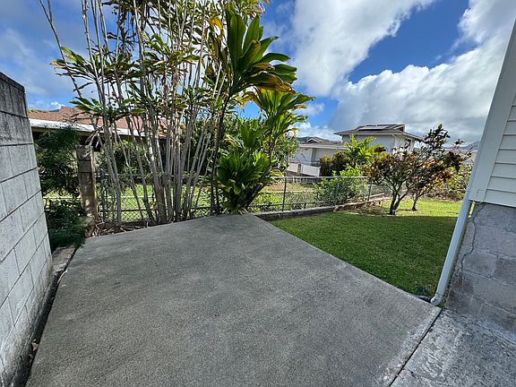 Relax in your own concrete patio and yard area.