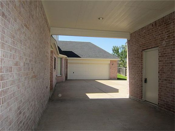 2 Attached garage in the back and the door on right enter into 3rd detached garage.