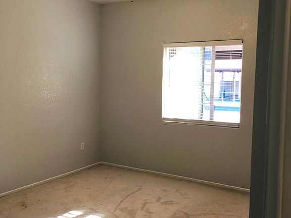 2nd bedroom with new ceiling fan installed in Nov. 2018; replaced carpet with wood tile in 2020