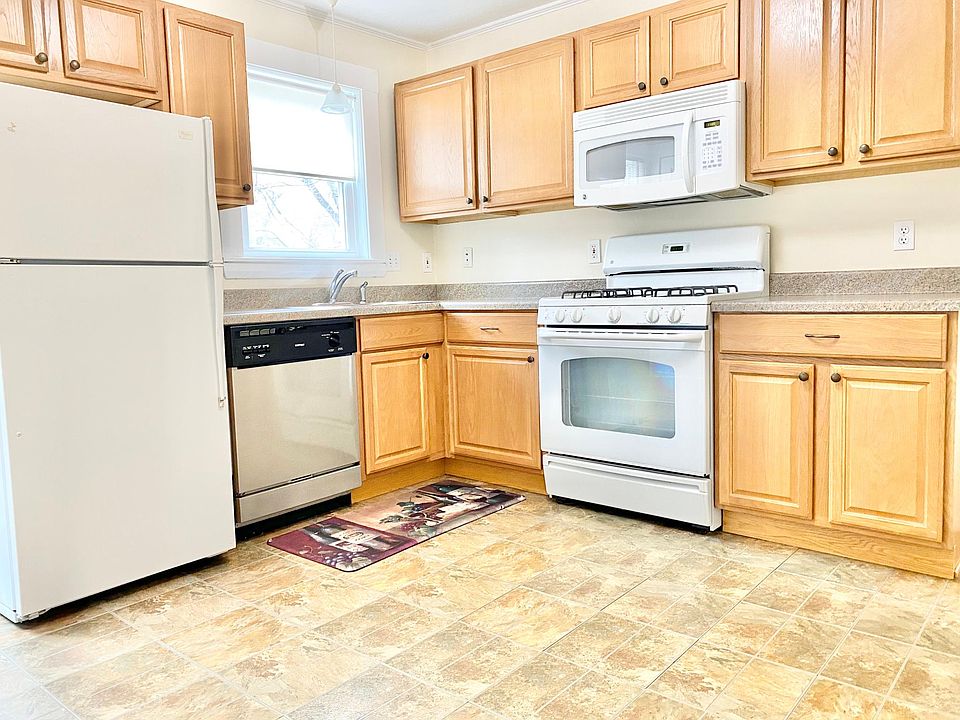 Kitchen is complete with a garbage disposal & door leading to nice yard with area for a grill and patio set.