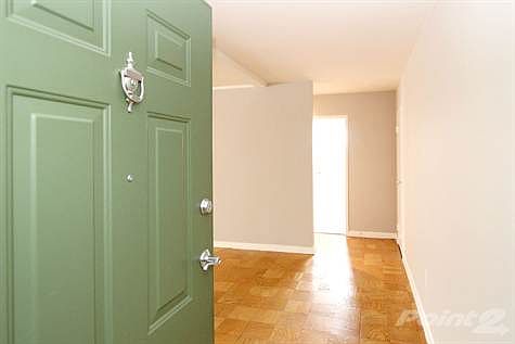 Fron Door opens to a small Entry & the Living Room