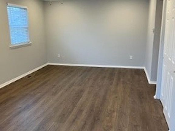Living Room Freshly Painted with Laminate Flooring.