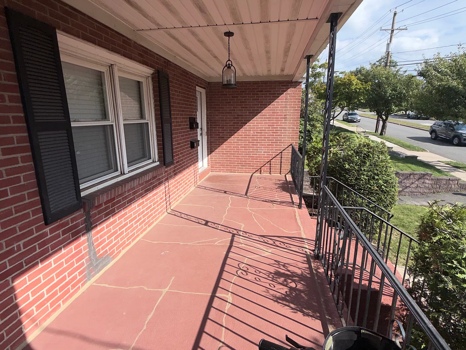 The covered front porch offers a charming spot to enjoy your morning coffee, greet guests or unwind at the end of the day.