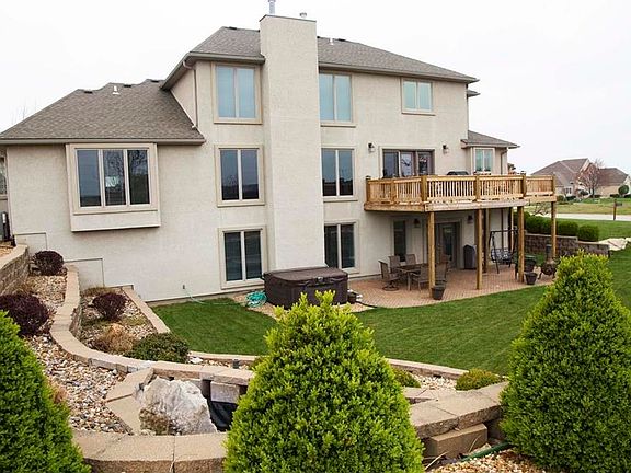 Enjoy the outdoors on the wrap around deck taking in the breathtaking details of the professional landscaping.  Room to entertain several guests to showcase this luxurious home.