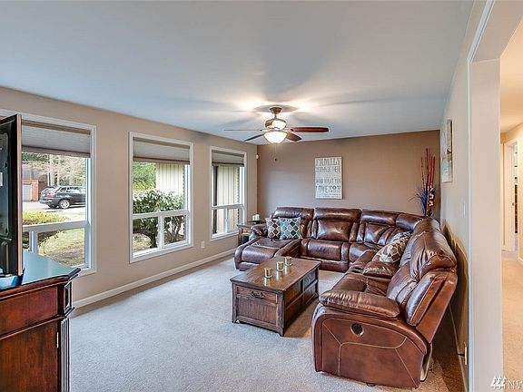 Spacious formal living room with great natural light. This home offers newer double pane, energy efficient windows throughout. 
